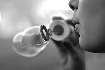 person blowing bubble