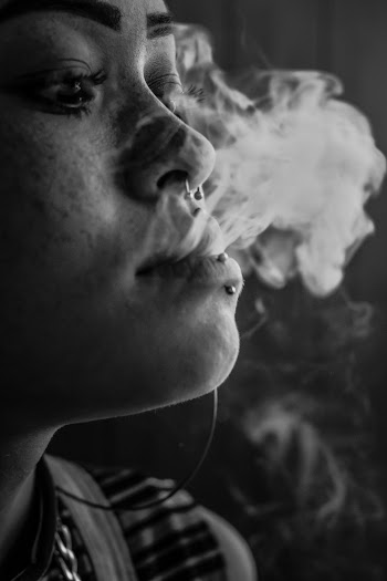 Person Blowing Smoke