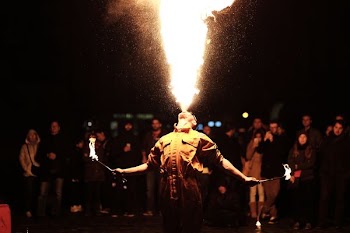 person breathing fire