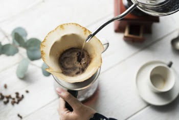 Person Brewing Coffee