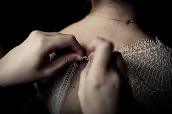 Person Buttoning White Shirt