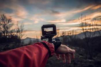 person carrying action camera