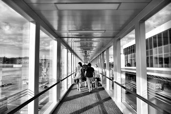 Person Carrying Bag Walking on Path Way