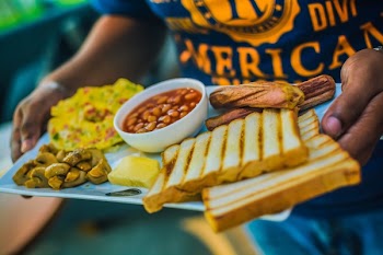 Person Carrying English Breakfast on White Tray