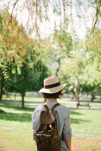 Person Carrying Leather Backpack