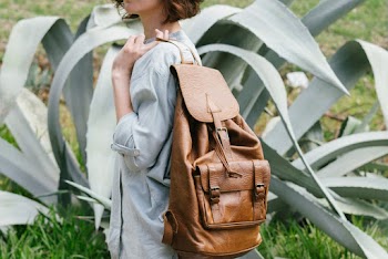 Person Carrying Leather Bag