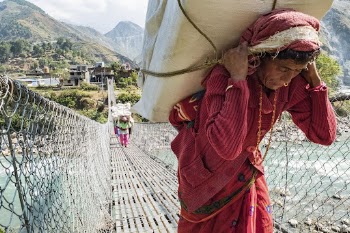 Person carrying paper bundles, Kailash, | Free Photo - rawpixel