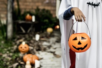 Person Carrying Pumpkin Bucket