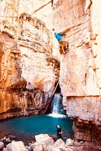 Person Climbing on Rock