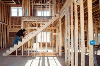 Person Climbing on Stairs Inside Building
