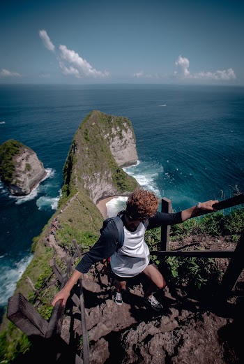 Person Climbing Up Rock Stairs