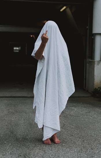 Person Covered by White Cloth