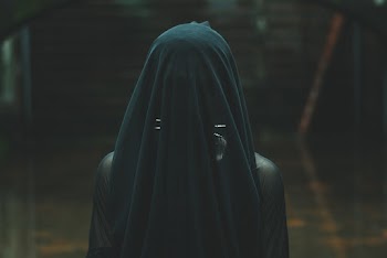 Person Covered with Black Textile