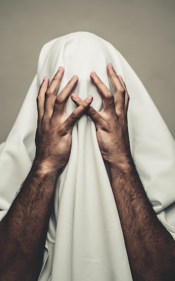 Person Covered with White Textile
