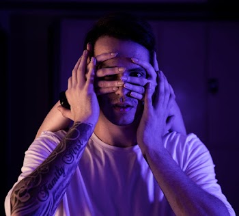 Person Covering A Man's Face 
