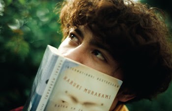 Person Covering Face With A Book
