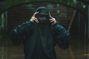 Person Covering His Face