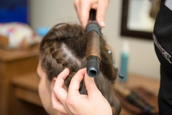 Person Curling A Woman's Hair