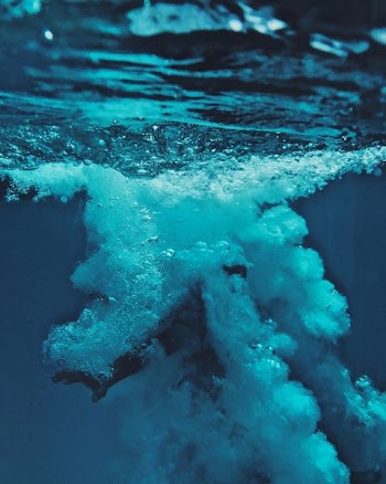 person dived on body of water