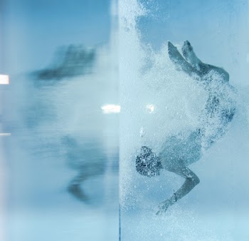 Person Diving Under Water