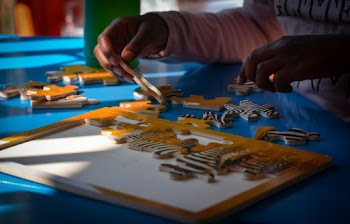 Person Doing A Puzzle