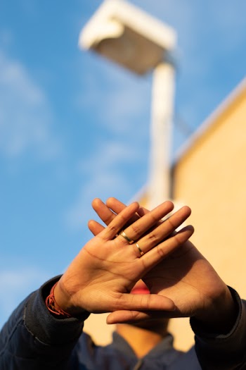Person Doing Triangle Sign