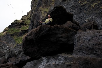 Person Doing Yoga on Rocky Mountain