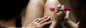 Person Draws Heart on her Leg