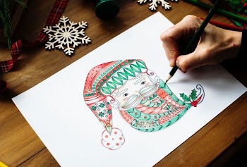 person draws Santa Claus face