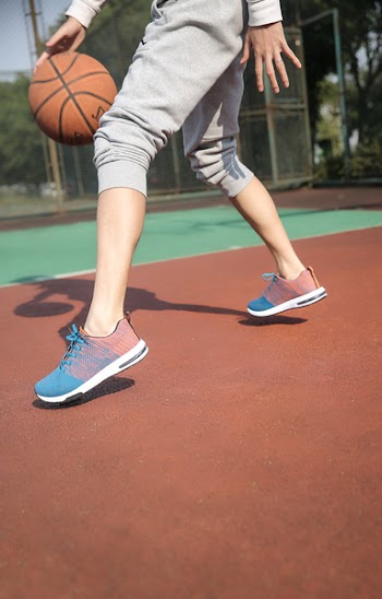 Person Dribbling Basketball