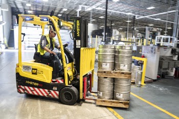 Person Driving Yellow Forklift