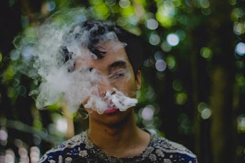Person Exhaling Smoke