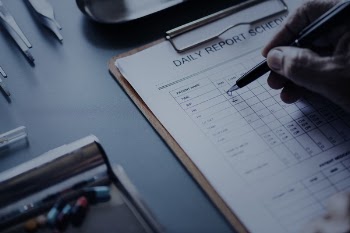 Person Filling out a Daily report