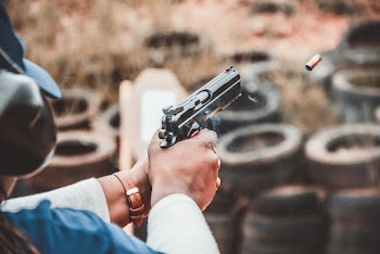 Person Firing Pistol