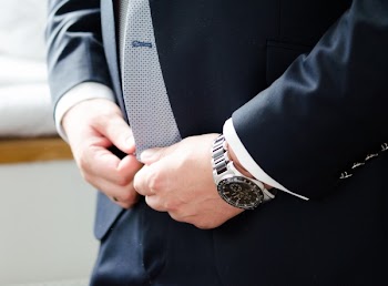 Person Fixing Blazer