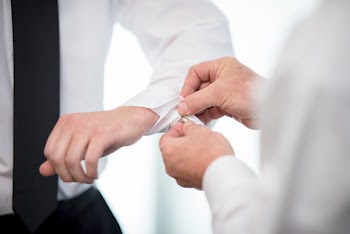Person Fixing the White Sleeve