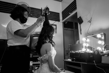 Person Fixing Woman's Hair