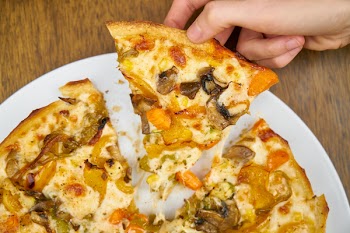 Person Getting a Pizza Slice