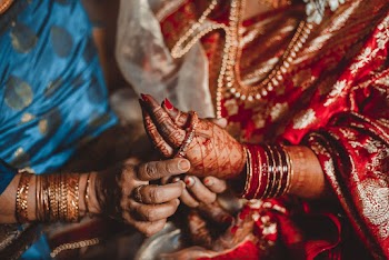 Person Grabbing a Bracelet on Left Hand