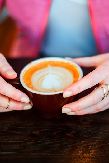 Person Hand Holding Brown Coffee Cup