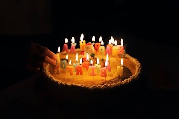 person hand holding candle