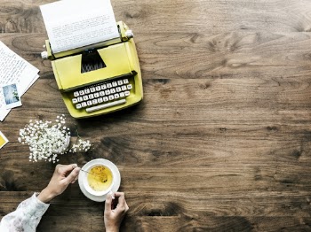 Person Having Tea While Working
