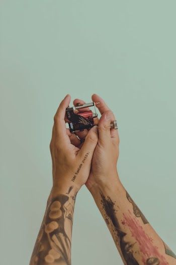 Person Hodling Red Handheld Tool
