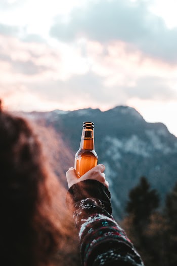 Person Holding a Bottle