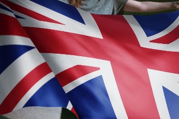 Person holding a British flag | Free Photo - rawpixel