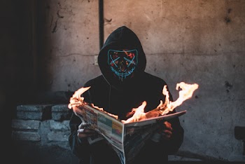 Person Holding a Burning News Paper Close-up Photography