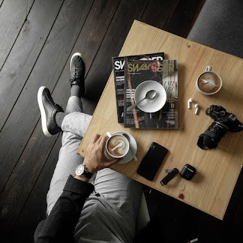Person Holding A Cup Of Coffee