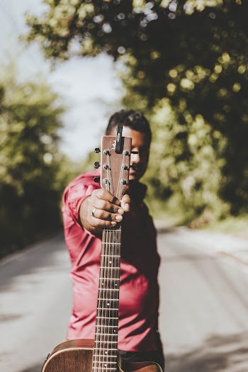 Person Holding a Guitar