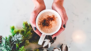 Person Holding A Mug
