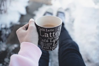 Person Holding A Mug
